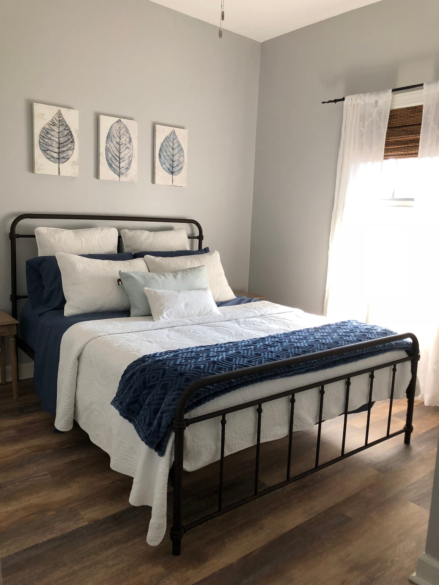 Queen bedroom with blue and white bedding